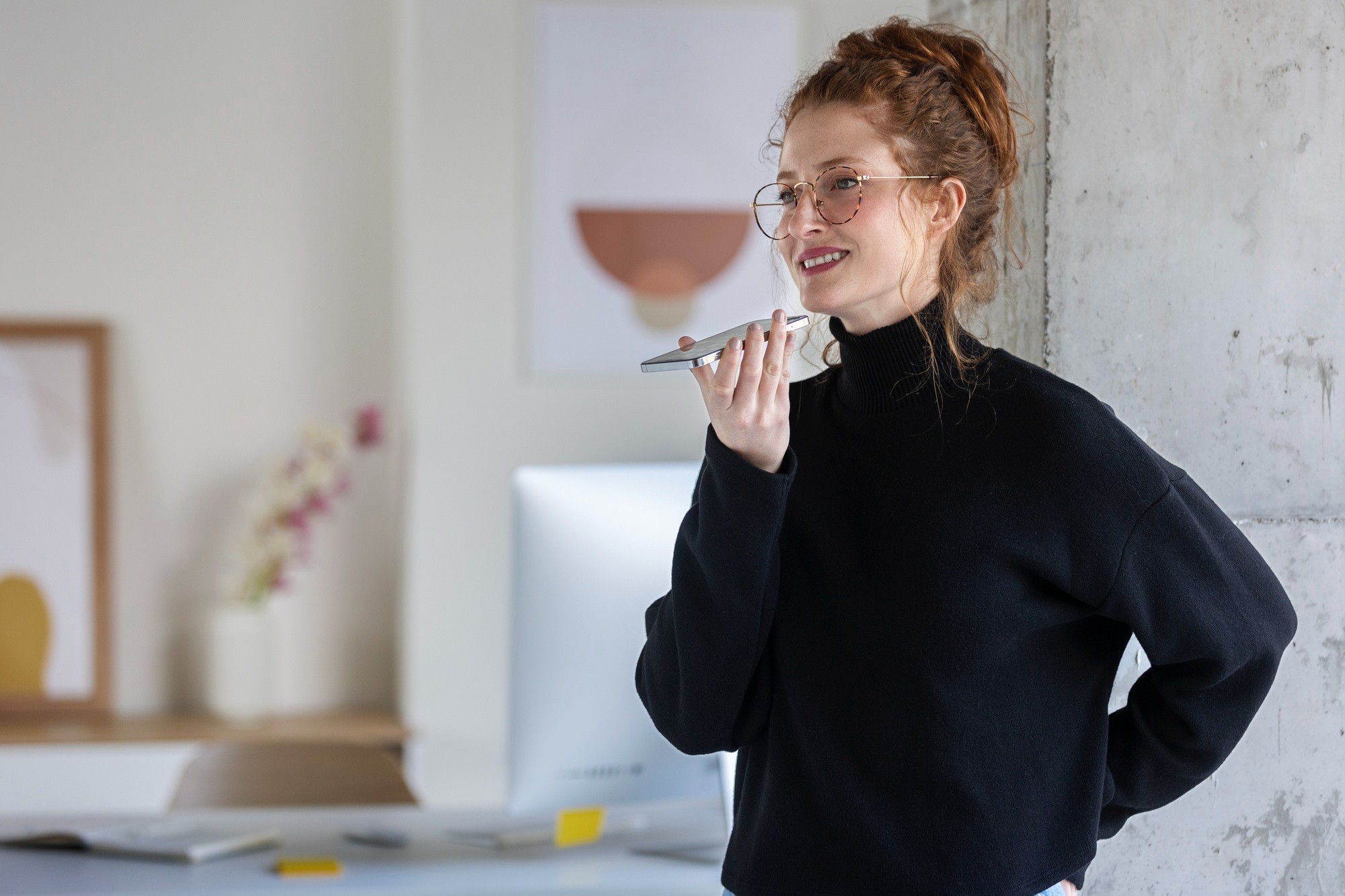 Illustration of a woman giving voice commands to a smartphone